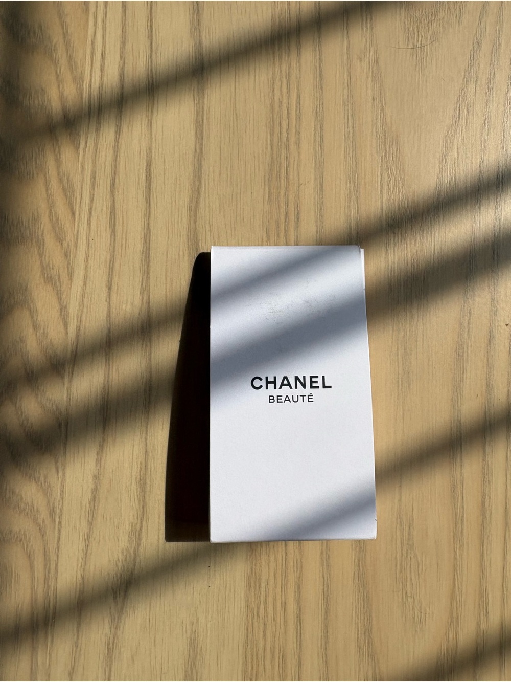Chanel Beauté silver-tone camellia